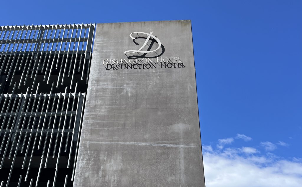 low angle of Distinction Hotel Signage